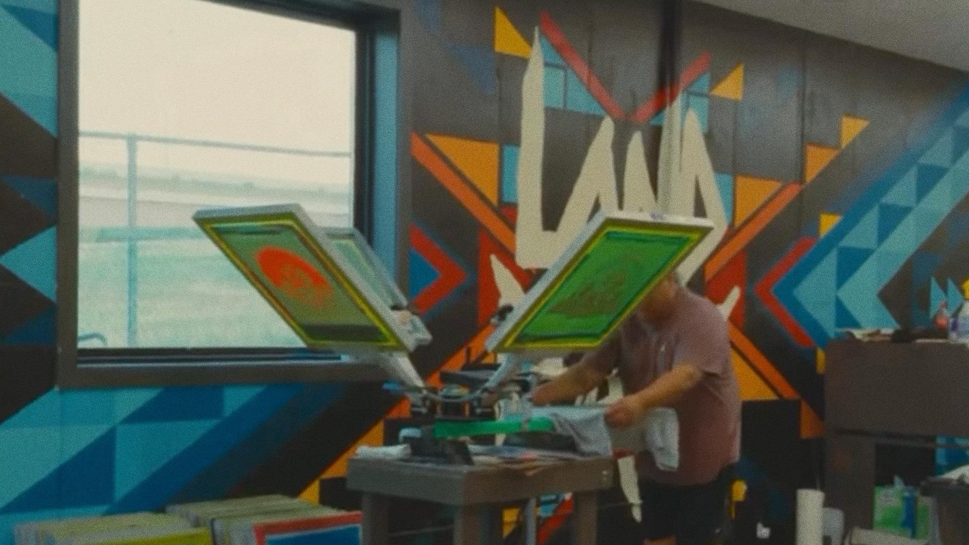 Screen printing custom apparel at the NDN Store